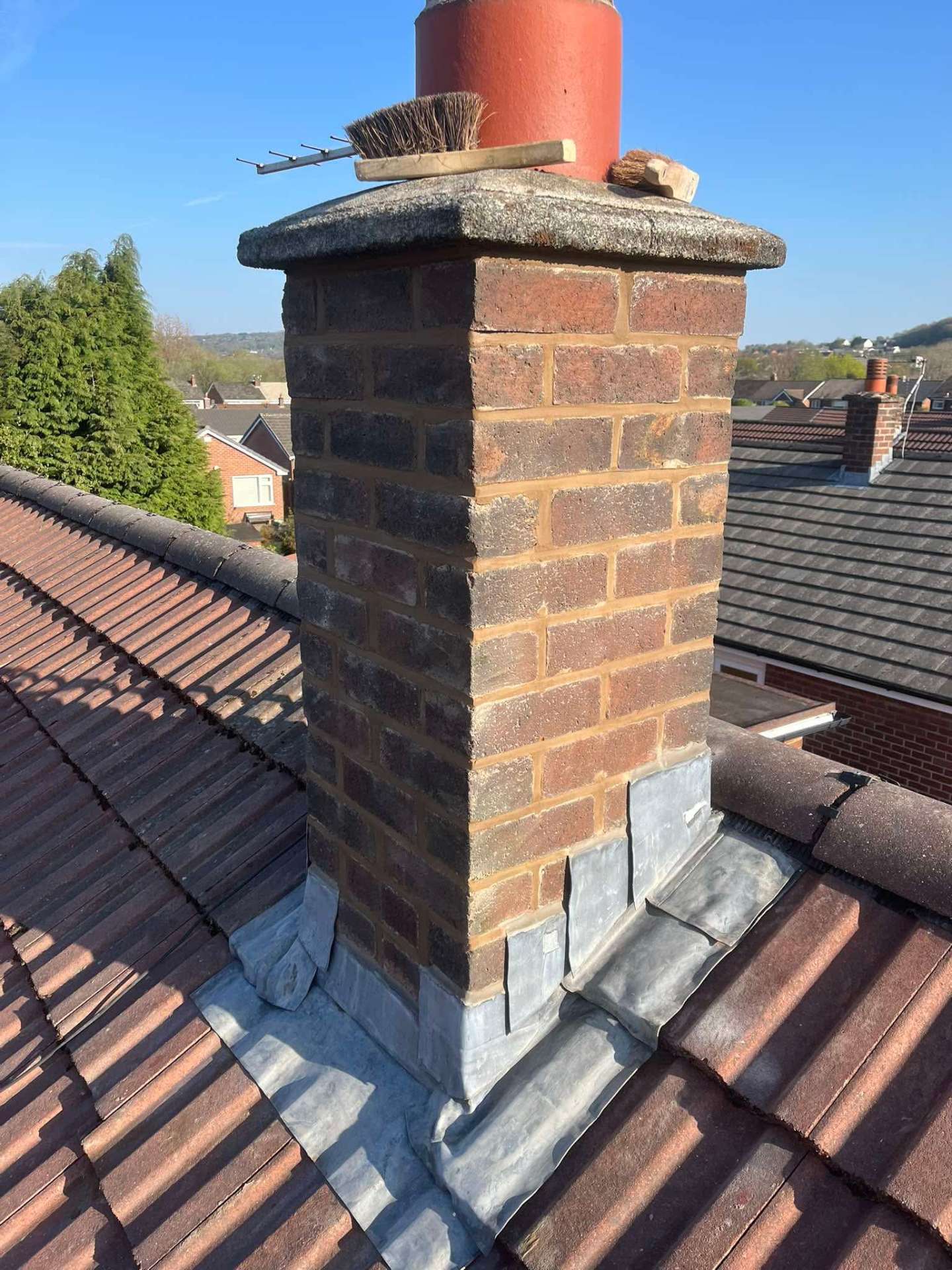 Rebuilt and repointed brick chimney
